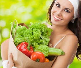 Woman buying vegetables Stock Photo