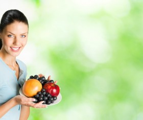 Woman holding fruit Stock Photo