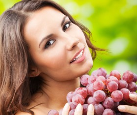 Woman holding grapes Stock Photo