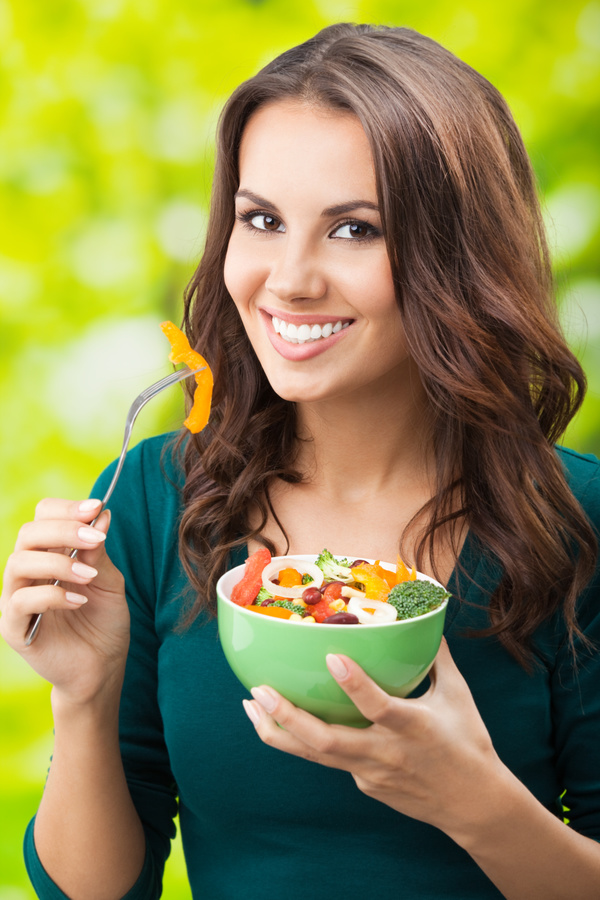 Woman holding vegetable salad Stock Photo