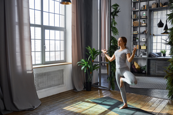 Woman practicing yoga in the living room Stock Photo 04