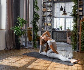 Woman practicing yoga in the living room Stock Photo 06