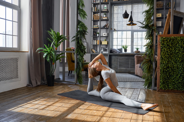 Woman practicing yoga in the living room Stock Photo 06