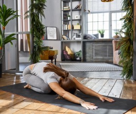 Woman practicing yoga in the living room Stock Photo 09