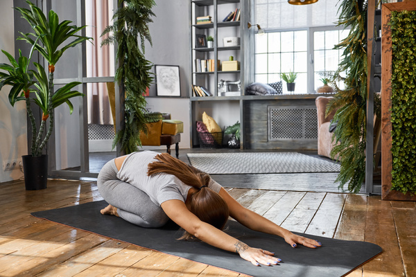 Woman practicing yoga in the living room Stock Photo 09