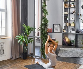 Woman practicing yoga in the living room Stock Photo 10