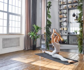 Woman practicing yoga in the living room Stock Photo 11