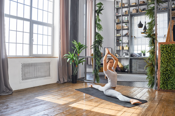 Woman practicing yoga in the living room Stock Photo 11