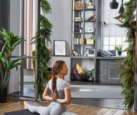 Woman practicing yoga in the living room Stock Photo 13