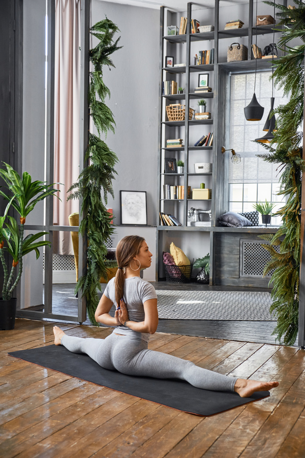 Woman practicing yoga in the living room Stock Photo 13