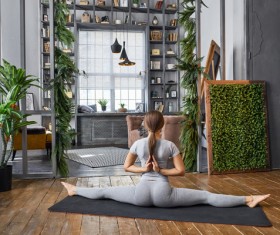 Woman practicing yoga in the living room Stock Photo 14