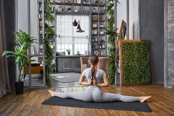 Woman practicing yoga in the living room Stock Photo 14