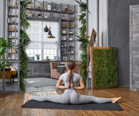 Woman practicing yoga in the living room Stock Photo 15