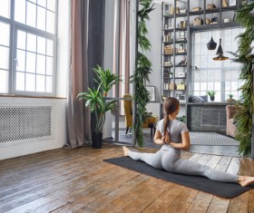 Woman practicing yoga in the living room Stock Photo 16
