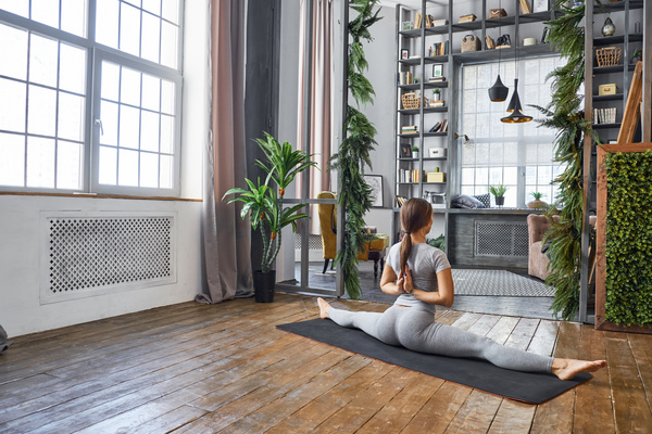 Woman practicing yoga in the living room Stock Photo 16