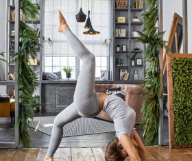 Woman practicing yoga in the living room Stock Photo 17