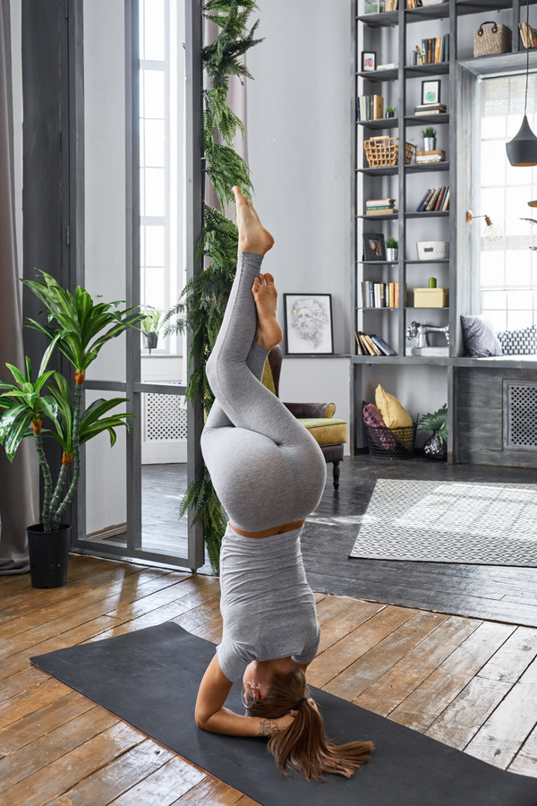 Woman practicing yoga in the living room Stock Photo 20