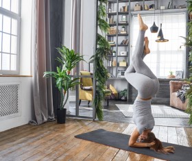 Woman practicing yoga in the living room Stock Photo 21