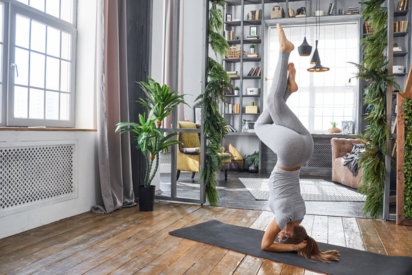 Woman practicing yoga in the living room Stock Photo 21