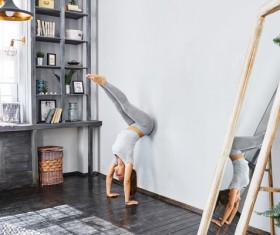 Woman practicing yoga in the living room Stock Photo 25