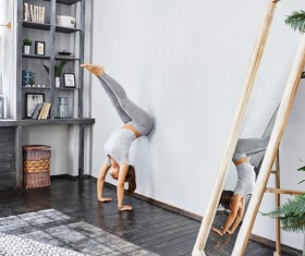 Woman practicing yoga in the living room Stock Photo 26