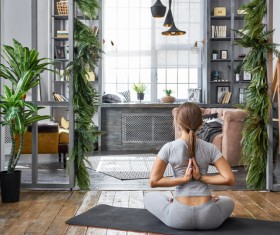 Woman practicing yoga in the living room Stock Photo 27