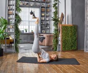 Woman practicing yoga in the living room Stock Photo 33