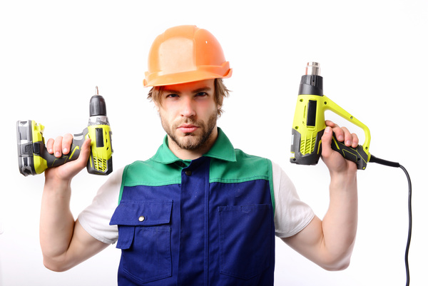 male worker with an electric drill Stock Photo
