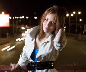 A beautiful woman on a night flyover Stock Photo