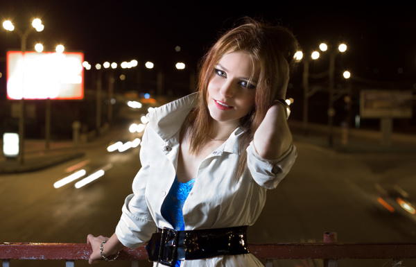 A beautiful woman on a night flyover Stock Photo