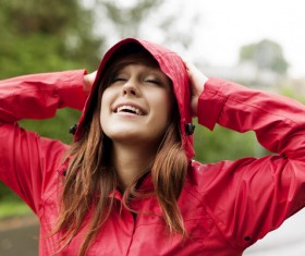 A woman in a raincoat Stock Photo