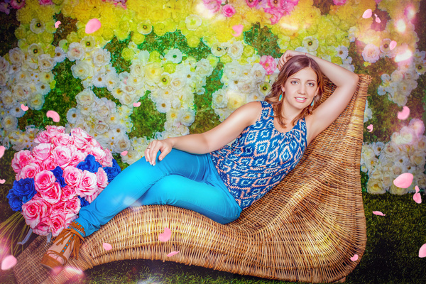 A woman lying on a rattan chair Stock Photo