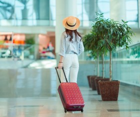 A woman pulling the box Stock Photo