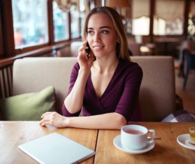 A woman who calls in a cafe Stock Photo 01