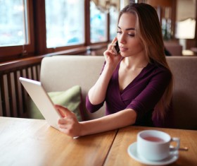 A woman who calls in a cafe Stock Photo 02
