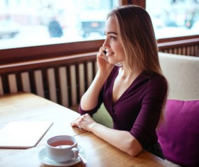 A woman who calls in a cafe Stock Photo 03