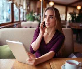 A woman who calls in a cafe Stock Photo 04