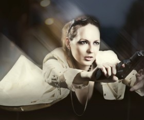 A woman with a gun Stock Photo