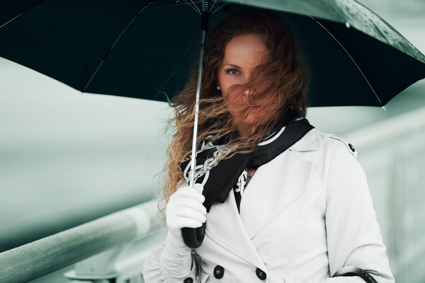 A woman with an umbrella on a rainy day Stock Photo 01
