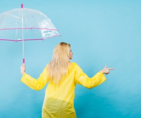 A woman with an umbrella on a rainy day Stock Photo 05
