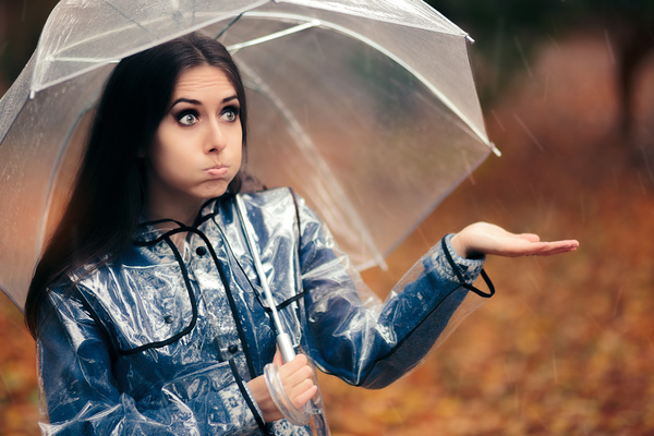 A woman with an umbrella on a rainy day Stock Photo