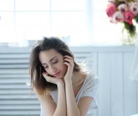 A young girl resting on the bed Stock Photo 08