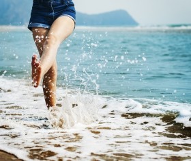 Beach girls play in the water Stock Photo