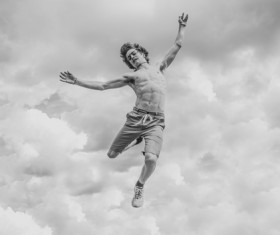 Black white picture of man jumping Stock Photo