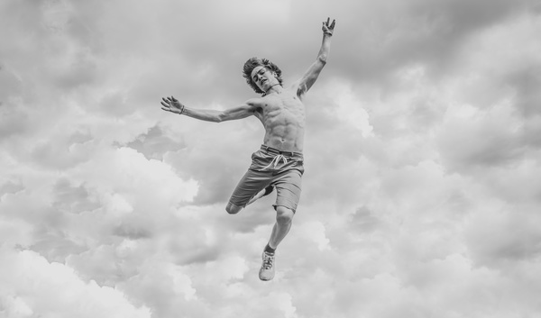 Black white picture of man jumping Stock Photo