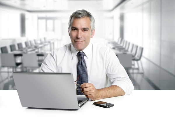 Business people with tablet PCs on the desktop Stock Photo