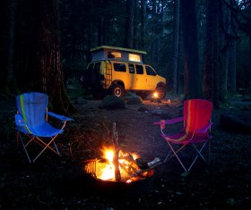Camping bonfire and RV Stock Photo