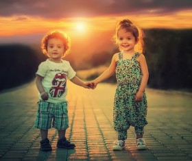 Children standing hand in hand Stock Photo