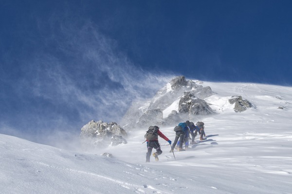 Climb snow-capped mountains Stock Photo