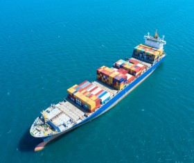 Container ship traveling at sea Stock Photo